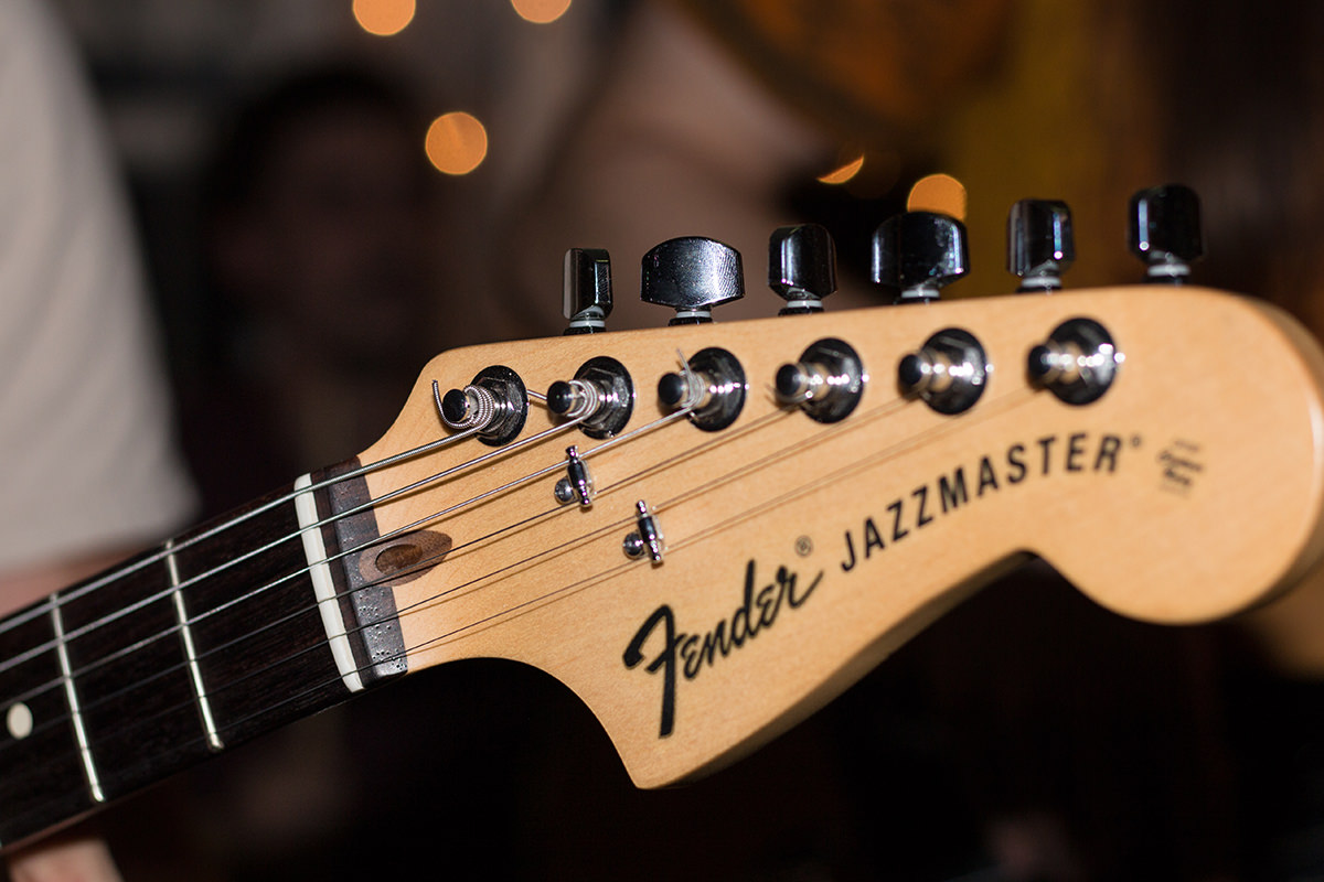 Sobre nosaltres Replay: foto de la punta d'una guitarra.